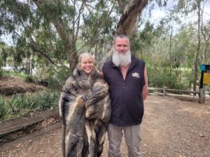 Image of Deb in possum skin cloak standing with wawa biik guide